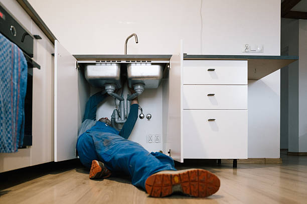 Professional Drain Cleaning technician working in Palm Springs, FL